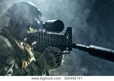 View From Clouds Of Smoke Of American Soldier Keeping Sight On Modern Gun Weapon. Ranker Having Oper
