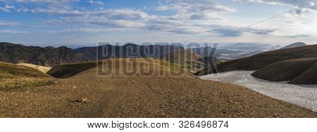 Colorful Rhyolit Mountain Panorma With Multicolored Volcanos And Geothermal Fumarole And River Delta