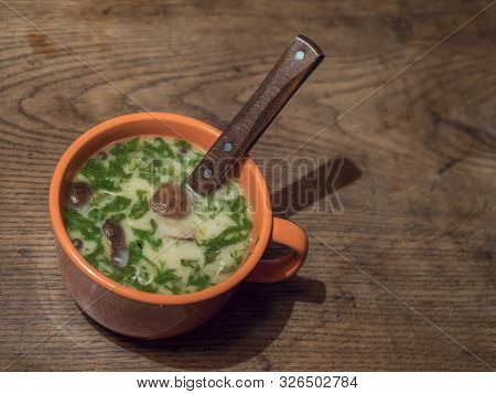 Homemade Czech Traditional Delicious Soup Kulajda With Mushroom, Eggs And Fresh Dill In Orange Cup A