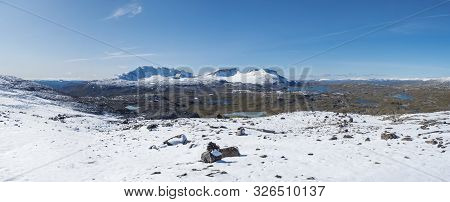 Wide Panorama View From Krossbu On Glacier Smorstabbreen, Snow-capped Mountains And Blue Lakes In Jo