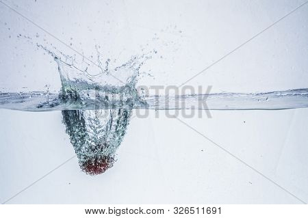 Ripe Rambutan Fruit In In Water Isolated On A White Background