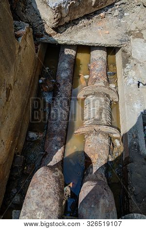 Old Leaky Pipes In The Pit. Preparation For Pipe Replacement.