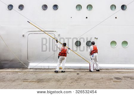 Worker Renovate The Ship's Side