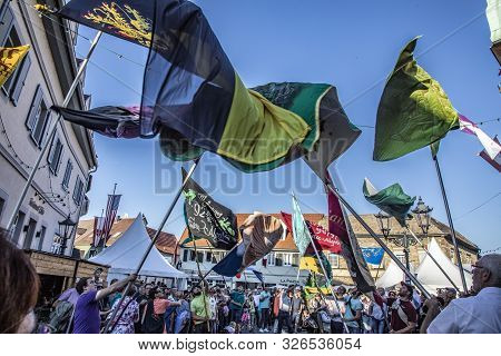 Gau-algesheim, Germany -october 14, 2018:  People Celebrate The Flag Swinging  At The Gau-algesheim 