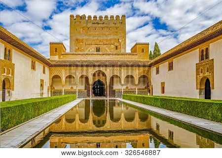 Granada, Spain - September 22, 2019: Columns And Tower Of The Alhambra In A Sunny Day. It´s A Nasrid