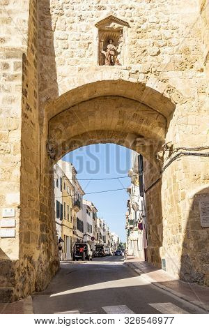Mahon, Spain - September 24, 2019: Historic Stone City Gate In Mahon Menorca Against A Blue Sunlit S