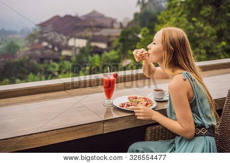 Woman Eating Delicious Strawberry Pizza On A Balinese Tropical Nature Background. Bali Island, Indon