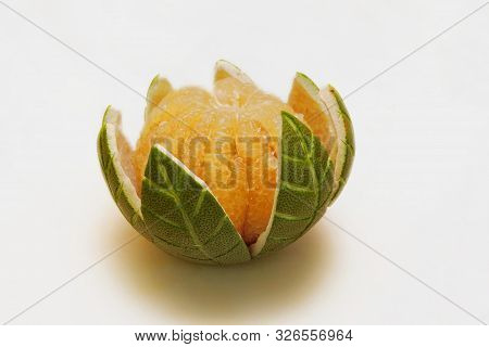A Pomelo Fruit With Its Peel Carved Into The Shape Of Leafs Is A Good Source Of Vitamin C And Health