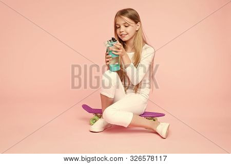 Healthy And Alive. Small Girl Skater Keeping Hydrated With Healthy Habits. Active Little Child Drink