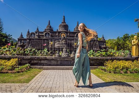 Young Woman Tourist In Budhist Temple Brahma Vihara Arama Banjar Bali, Indonesia