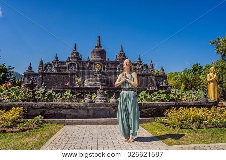 Young Woman Tourist In Budhist Temple Brahma Vihara Arama Banjar Bali, Indonesia