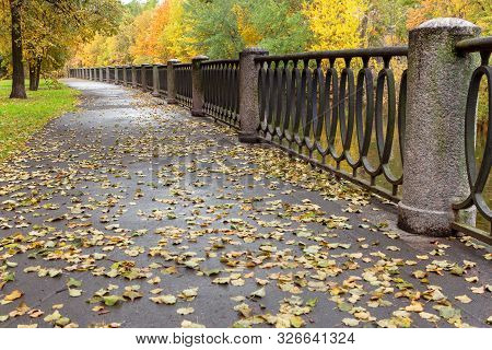 Colorful Autumn On The Empty Embankment Of The Karpovka River. St. Petersburg, Petrograd Side