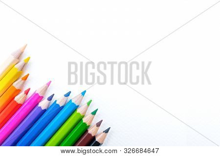 Top View Of Colourful Crayons Or Colour Pencil Set In Range Isolated On White Paper Background.educa
