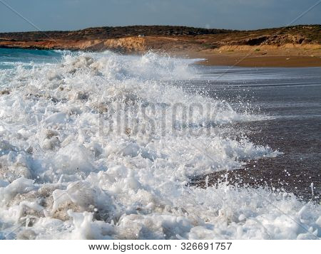 Foam And Waves In The Sea On A Sunny Day. Foam And Waves In The Sea. Powerful Waves Crushing For Bac