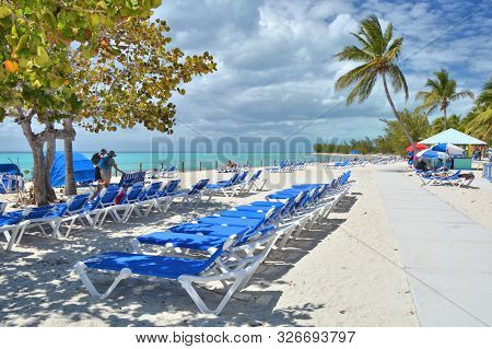 Blue Sunbeds On Beautiful White Sand Beach. Eleuthera Island, Bahamas.