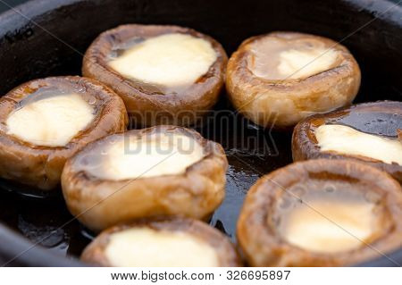 Close Up Mushrooms Baked With Cheese Suluguni On Ketsi. Georgian Cousine.