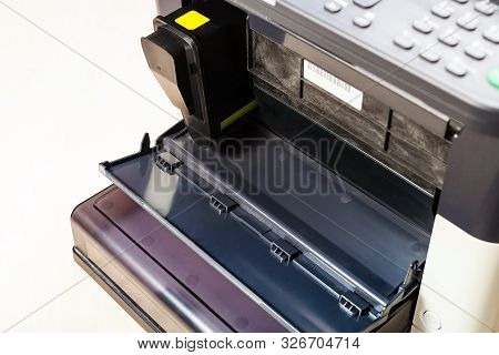 New Toner Cartridge In Laser Multi Function Device On Pale Table In Office