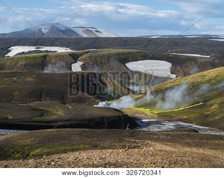 Landmannalaugar Colorful Rhyolit Mountains With Steam From Hot Spring On Famous Laugavegur Trek. Fja