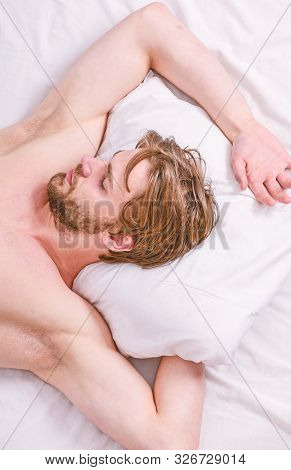 How Much Sleep You Actually Need. Bearded Man Sleeping Face Relaxing On Pillow. Man Handsome Guy Lay