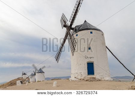 Horizontal View Of Old Windmills On Calderico Hill Of The Spanish Municipality Of Consuegra. These W
