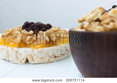 Rice Biscuit With Cream And Sweet Papaya, Nuts And Raisins.