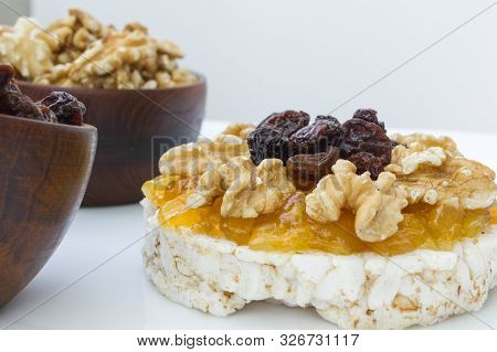 Rice Biscuit With Cream And Sweet Papaya, Nuts And Raisins.