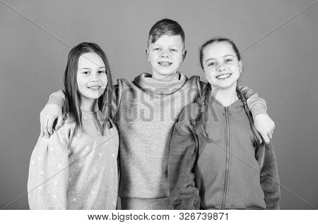 Children Smiling Faces On Violet Background. Friends Hug. Childrens Day. Cheerful Youth. Relations A