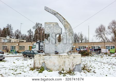 Troitskoye, Russia - November 2016: Concrete Sculpture Sickle And Hammer In The Village Of Troitskoe