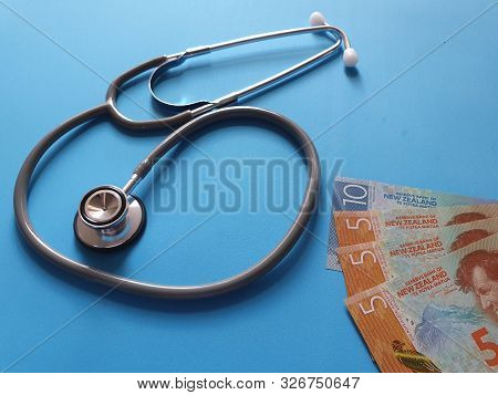 Investment In Health Care, New Zealand Money And Stethoscope For Medical Check