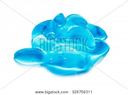 Squeezed cosmetic clear cream gel texture Iisolated on white background. Close up photo of transparent drop of skin care product. High Quality transparent gel with bubbles closeup on white background