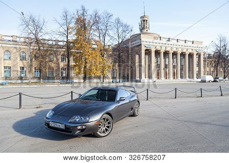 Novosibirsk, Russia - 10.09.2019: A Rare Japanese Sports Car In The Back Of A Gray Toyota Supra Coup