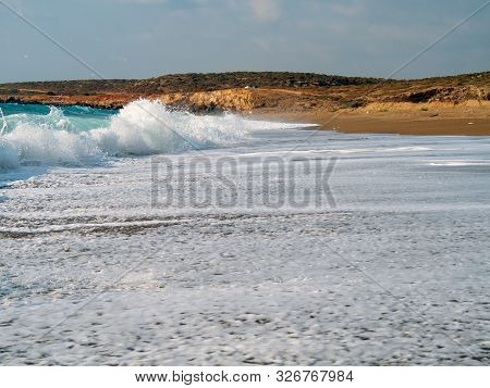 Foam And Waves In The Sea On A Sunny Day. Foam And Waves In The Sea. Powerful Waves Crushing For Bac