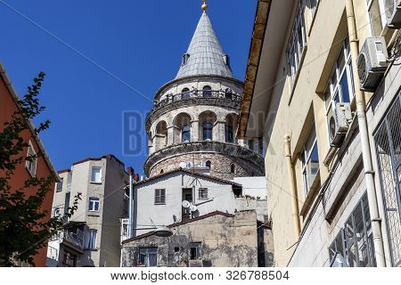 Istanbul, Turkey - July 26, 2019: Galata Tower At The Center Of City Of Istanbul, Turkey