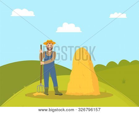 Farming Person And Hay Bale. Man Holding Hayfork And Smiling. Farmland Field With Green Grass And Ha