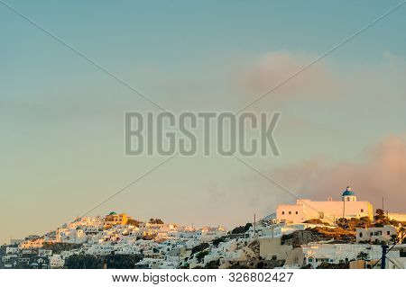 Santorini And The Sky Makes Wonderful Combination To Impress Every Tourist By Its View. White Color 