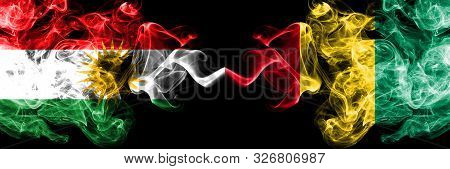 Kurdistan Vs Guinea, Guinean Smoke Flags Placed Side By Side. Thick Colored Silky Smoke Flags Of Kur
