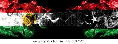 Kurdistan Vs Libya, Libyan Smoke Flags Placed Side By Side. Thick Colored Silky Smoke Flags Of Kurds