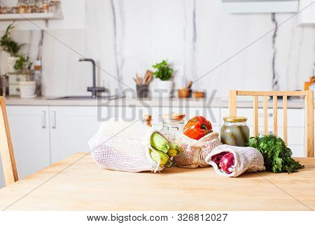 Kitchen Interiour And Table With Groceries In Textile Bags