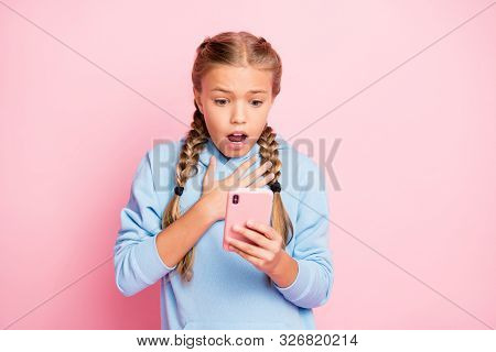 Photo Of Trendy Terrified Blonde Haired White Casual Schoolgirl Expressing Negative Amazement Wearin