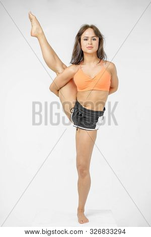 Cute Girl Doing Yoga On White Background Isolated.