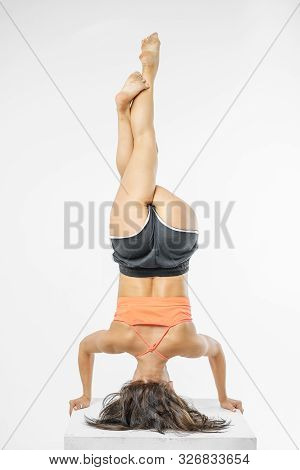 Cute Girl Doing Yoga On White Background Isolated.