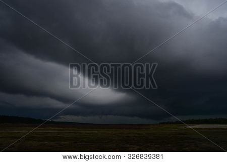 The Sky Is Obscured By Dark, Storm Clouds.
The Sky With Dark, Black Storm Clouds. They Awake, Testif