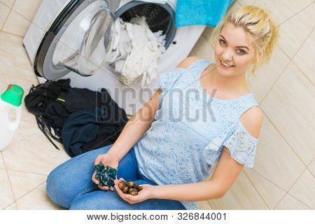 Woman Comparing Washing Laundry Nuts And Chemicals Detergent Blue Pods. Alternative Household Duties