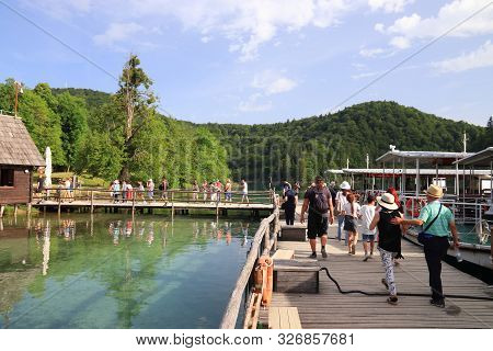 Plitvice, Croatia - June 15, 2019: People Visit Plitvice Lakes National Park (plitvicka Jezera) In C