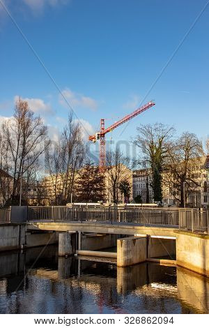 Water City Leipzig-future City Harbor With Persons Boats, Lock
, Houses And Construction Site In The