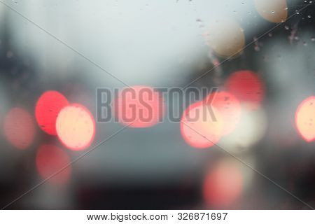City View Through Blurry With Heavy Rain On The Car Window. Driving In Rain, Rainy Weather