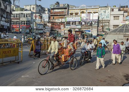 New Delhi, India - Nov 17, 2011: Man Carries  Cargo And People With His Rickshaw  In Old Delhi, Chaw