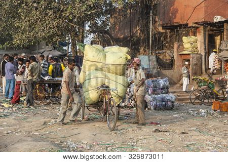 New Delhi, India - Nov 17, 2011: Man Carries  Heavy Cargo  With His Rickshaw  In Old Delhi, Chawri B