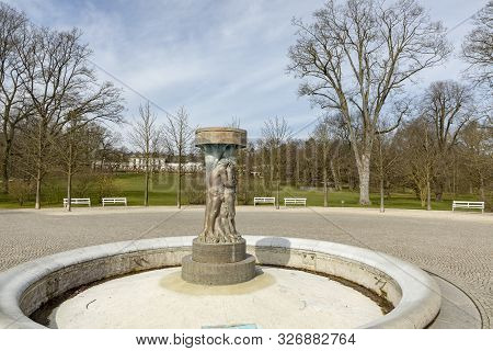 Bad Nauheim, Germany - Mar 30, 2018: Fountain Adam And Eve In Paradise In Bad Nauheim, Germany. Arti