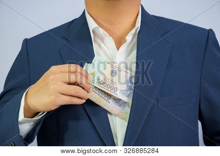 Money In Vietnam Hold On Hand Business Man Wearing A Blue Suit (socialist Republic Of Vietnam), Dong